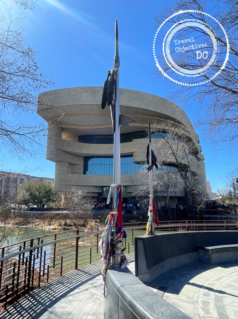 Two spears, pointed toward the heavens with prayer cloths tied to their bases. 